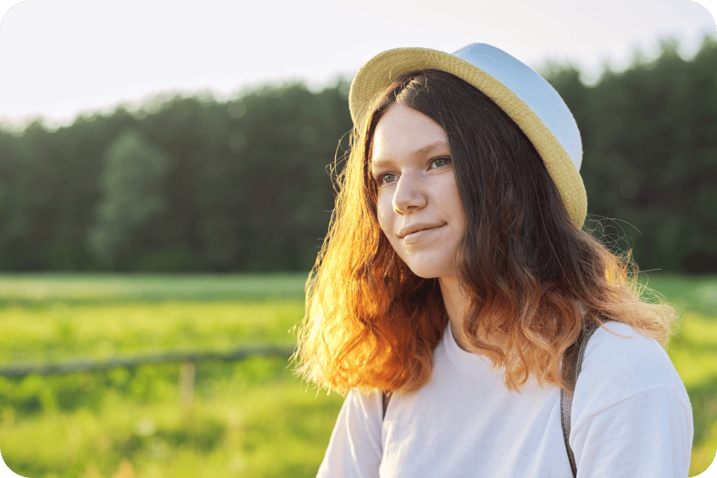 ND-Young-Girl-w-Hat Student at Laraway enjoying a beautiful dusk view of the landscape